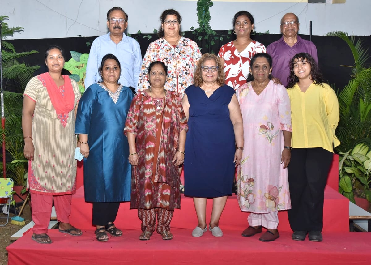 Toddlers Nursery school team standing together during a school event